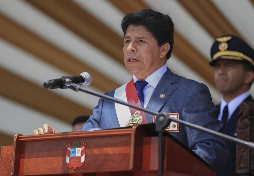 This handout picture released by Peruvian Presidency shows Peruvian President Pedro Castillo delivering a speech during a ceremony to commemorate the anniversary of the police forces in Lima on December 6, 2022. - Peru is under the shadow of uncertainty as to what will happen on December 7 when a discredited Congress will attempt to impeach, for the third time in 16 months, President Pedro Castillo, who is being investigated by prosecutors for corruption and whose term of office ends in 2026. (Photo by Jhonel RODRIGUEZ / Peruvian Presidency / AFP) / RESTRICTED TO EDITORIAL USE - MANDATORY CREDIT "AFP PHOTO / PERUVIAN PRESIDENCY / JHONEL RODRIGUEZ" - NO MARKETING NO ADVERTISING CAMPAIGNS - DISTRIBUTED AS A SERVICE TO CLIENTS