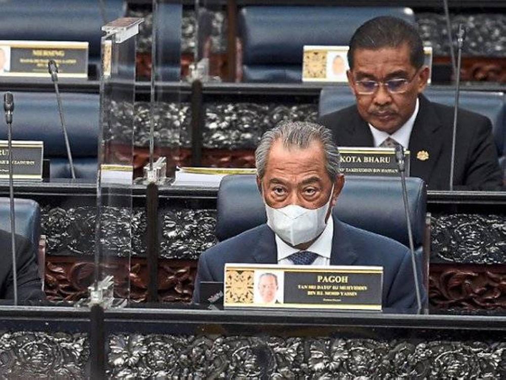 Perdana Menteri Tan Sri Muhyiddin Yassin bersama Takiyuddin pada Persidangan Parlimen Penggal Ketiga Parlimen ke-14. -Foto Bernama