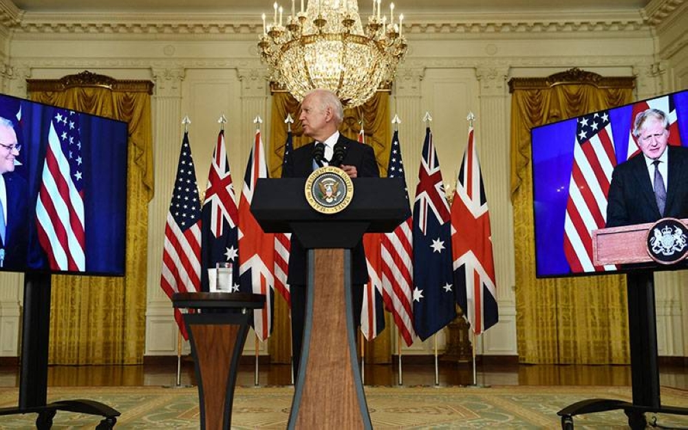 Presiden Amerika Syarikat, Joe Biden dalam sidang media secara maya bersama Perdana Menteri UK, Boris Johnson (kanan) and Perdana Menteri Australia, Scott Morrison di Washington baru-baru ini. - AFP