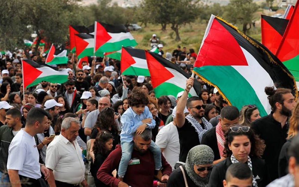 Bendera Palestin kerap dikibarkan semasa tunjuk perasaan di adakan di Israel. - Foto AFP
Foto AFP