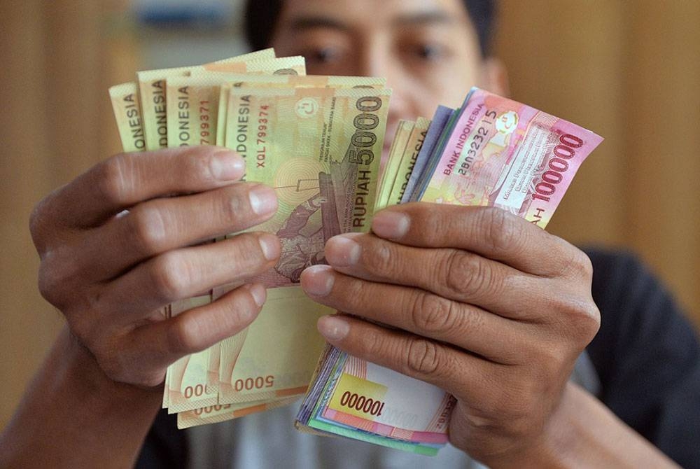 Indonesia mengutamakan rupiah dalam perdagangannya dengan beberapa negara asing. - Foto AFP