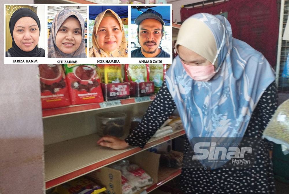 Salmah menunjukkan rak untuk menempatkan telur di kedai runcit kosong kerana kesukaran mendapatkan barangan keperluan itu.