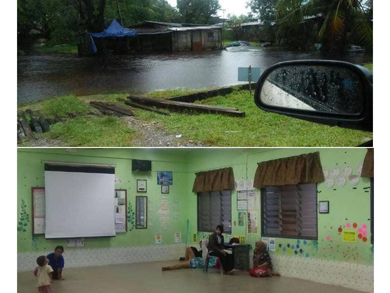 Kediaman mangsa dinaiki air awal pagi tadi. Gambar bawah: Sebuah keluarga dari Kampung Baru dipindahkan ke pusat pemindahan sementara 9 pagi tadi. - Foto Ihsan Angkatan pertahanan Awam Pahang