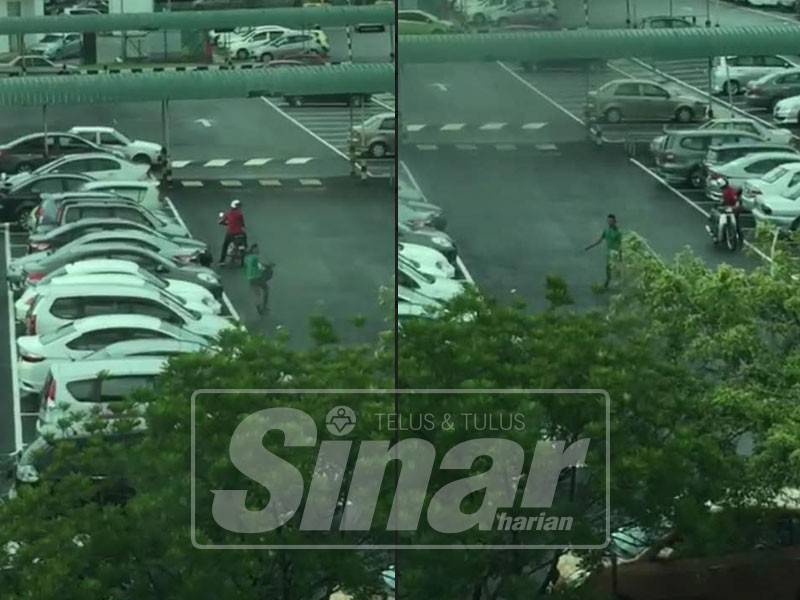 Paparan skrin video tular memaparkan tindakan dua lelaki yang melarikan sebuah beg