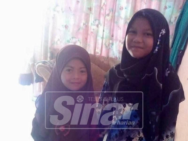 Nur Fatihah (kanan) dan adiknya yang hilang selepas keluar dari rumah mereka tiga hari lalu.
