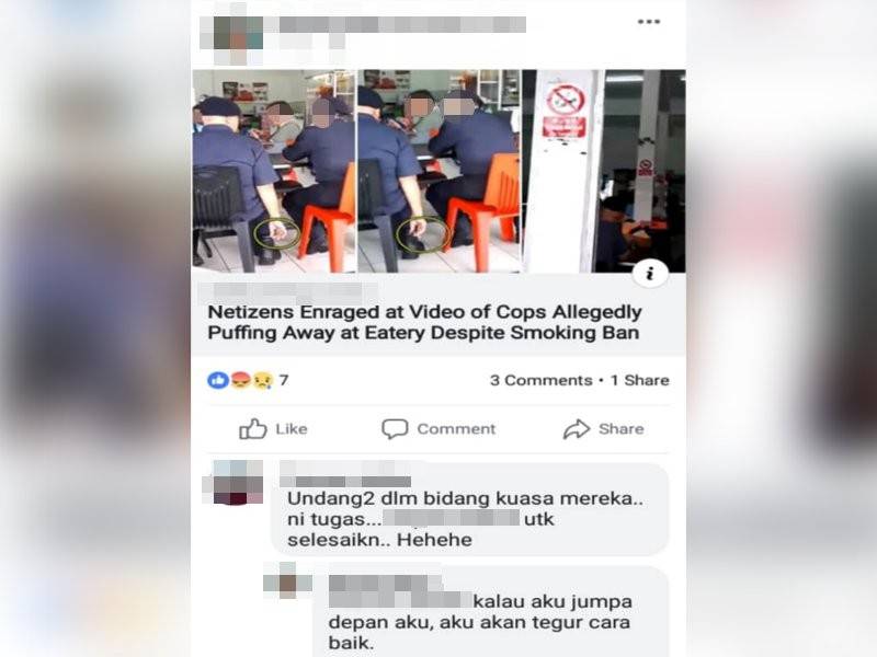 Gambar anggota polis merokok di premis makanan yang tular di laman sosial.
