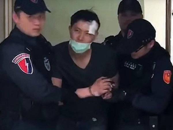 Wan (tengah) dilaporkan enggan memberi kerjasama dengan polis Taiwan.