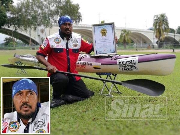 Murad bersama kanu serta plak MBOR yang diterimanya.