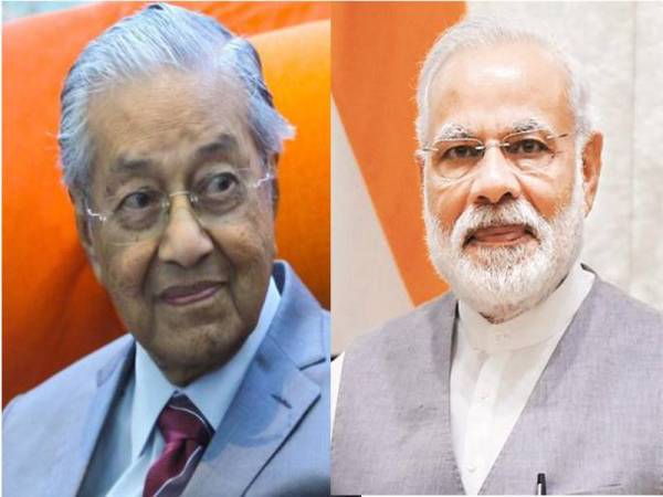 Mahathir Mohamad (kiri) mengucapkan tahniah kepada Perdana Menteri India Narendra Modi atas kemenangan bersejarahnya dalam pilihan raya Lok Sabha.