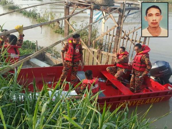 Anggota bomba dalam usaha menaikkan mayat mangsa yang ditemui pagi tadi. - Foto ihsan bomba Gambar kecil: Firdaus