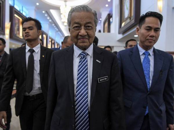 Perdana Menteri Tun Dr Mahathir Mohamad (tengah) hadir pada Persidangan Dewan Rakyat di Parlimen hari ini.  - Foto BERNAMA