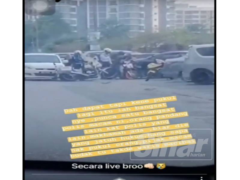 Tangkap layar video yang tular mengatakan anggota polis berkenaan memukul remaja tersebut.