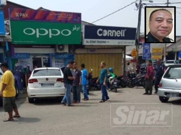 Lokasi kejadian suami isteri ditetak berhampiran sebuah bank di bandar Kuala Krai hari ini. Gambar kecil, Wan Fauzi.