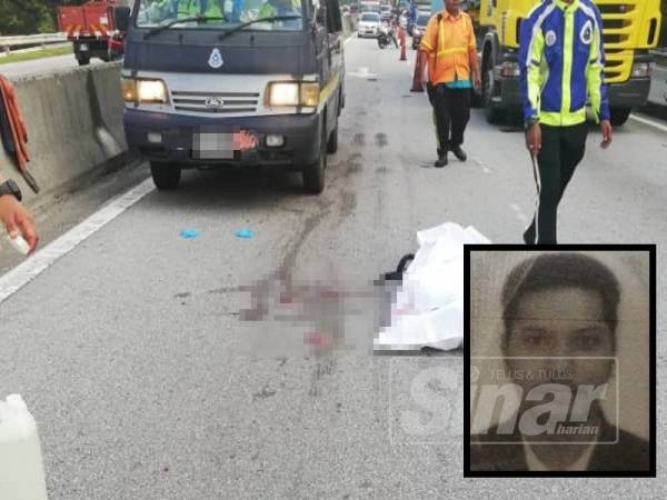 Mangsa maut di lokasi kejadian selepas parah diseret hampir sepuluh meter dalam kemalangan di KM5 Lebuhraya DUKE petang semalam. (Mangsa: Mohammad Khairul Anuar)