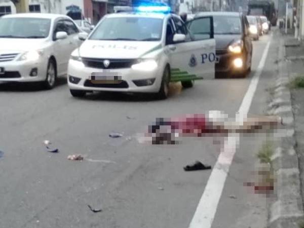 Mangsa mengalami kecederaan serius di kepala maut selepas dirempuh sebuah lori ketika melintas jalan di Kampar hari ini. - Foto IHSAN PEMBACA