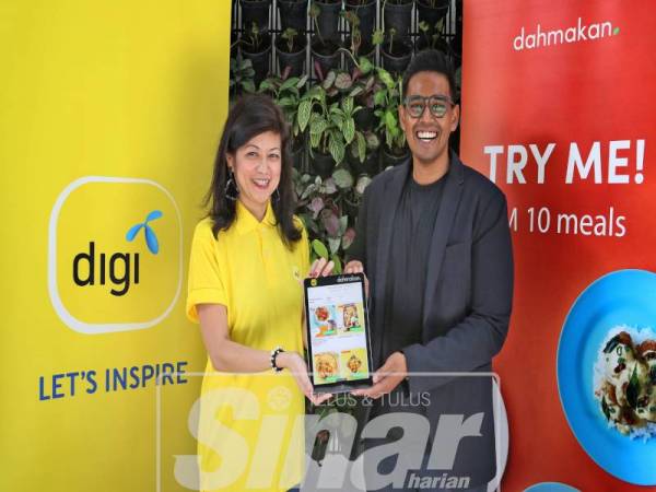 KETUA Pengurusan Infrastruktur Korporat Digi, Sue Ann Lim bersama Ketua Solusi Korporat, Aaron Raj sempena pelancaran aplikasi dahmakan, baru-baru ini.