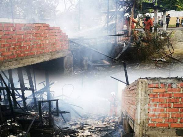 Anggota bomba memadamkan kebakaran yang memusnahkan dua rumah di Kampung Melayu Majidee pagi tadi. - Foto Ihsan Bomba Johor