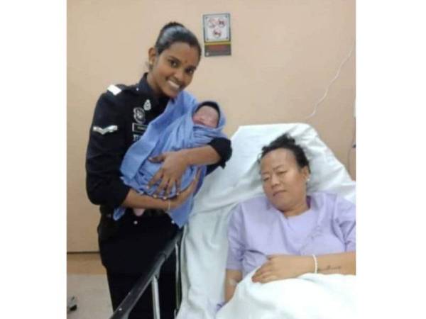 Komathi melawat wanita berkenaan dan bayinya di hospital. - Foto ihsan Polis KL