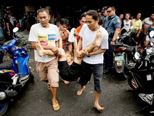 Seorang suspek narkotik ditembak semasa operasi dadah di sebuah kawasan setinggn di pinggir Manila.