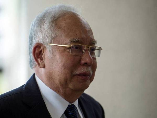 Bekas Perdana Menteri Datuk Seri Najib Tun Razak ketika tiba bagi perbicaraan berhubung kes 1Malaysia Development Berhad (1MDB) di Kompleks Mahkamah Kuala Lumpur hari ini. - Foto Bernama