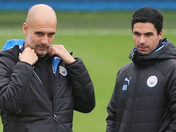 Pep Guardiola bersama Mikel Arteta -Foto AFP