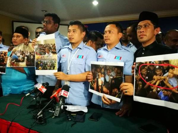 Hilman (tengah) pada sidang akhbar yang diadakan di D'Village Resort berasingan dari lokasi kongres tersebut hari ini.