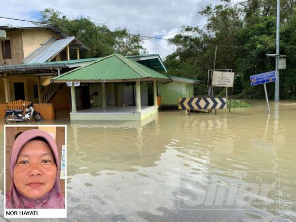 Sebuah surau di kawasan Kampung Kusial turut dinaiki air.