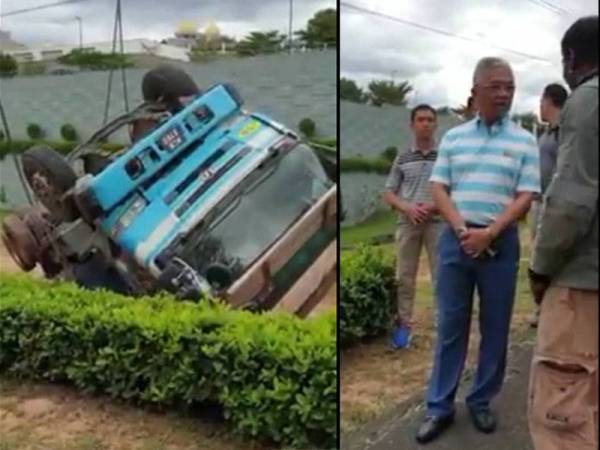 Al-Sultan Abdullah mencemar duli bertemu pekerja yang sedang melakukan kerja-kerja mengalihkan lori terbalik berdekatan Istana Negara.