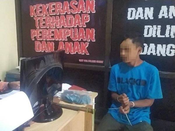 Suspek ditahan pihak berkuasa untuk disoal siasat kerana menyiram air panas pada tubuh isterinya. - Foto AGENSI