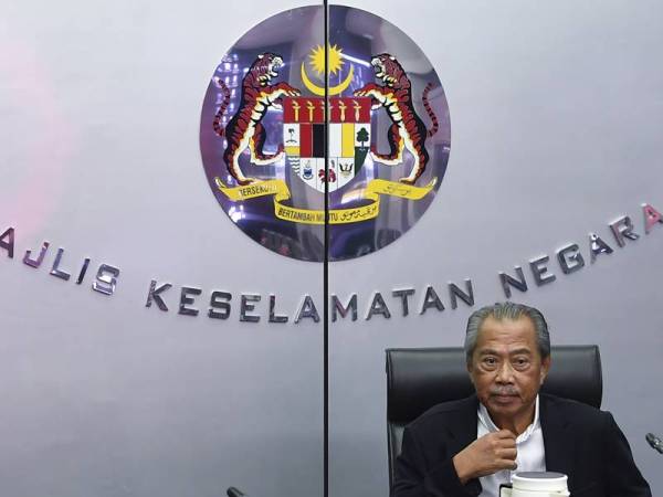 Muhyiddin mempengerusikan Mesyuarat Penyelarasan Covid-19 di Ibu Pejabat Majlis Keselamatan Negara (MKN) di Bangunan Perdana Putra hari ini. - Foto Bernama