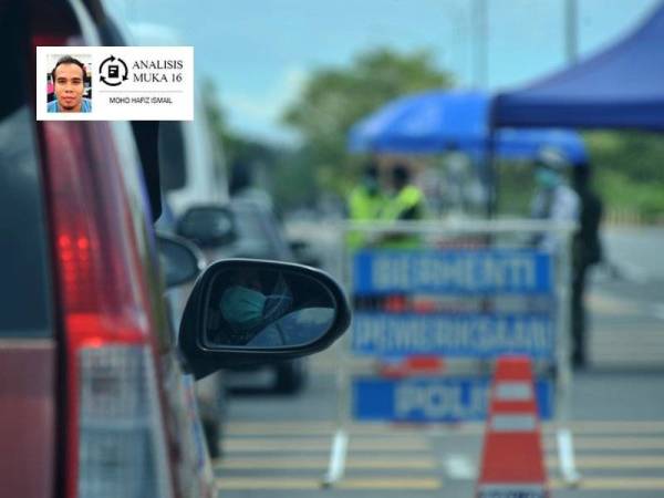 Anggota polis dan tentera membuat sekatan jalan raya bagi menasihati orang ramai yang masih lagi keluar rumah. -Foto Bernama