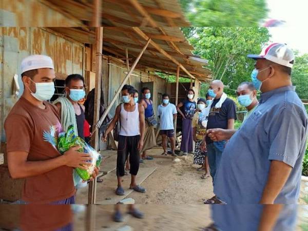 Mohamad Sahabudin (kanan) meninjau keadaan buruh warga asing yang terputus bekalan makanan di Baling hari ini.