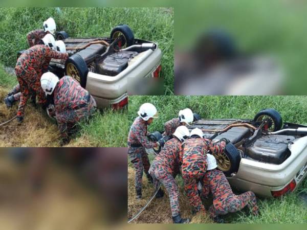 Anggota bomba mengeluarkan mangsa yang terperangkap seleaps kereta dipandunya terbalik masuk parit di Parit Semerah, Taman Saujana, Pontian, Johor hari ini.