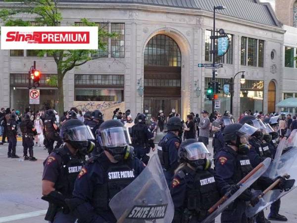 Kawasan State Street di Madison, Wisconsin dikawal oleh pihak polis walaupun belum ada arahan pelaksanaan perintah berkurung di kawasan terbabit setakat semalam.