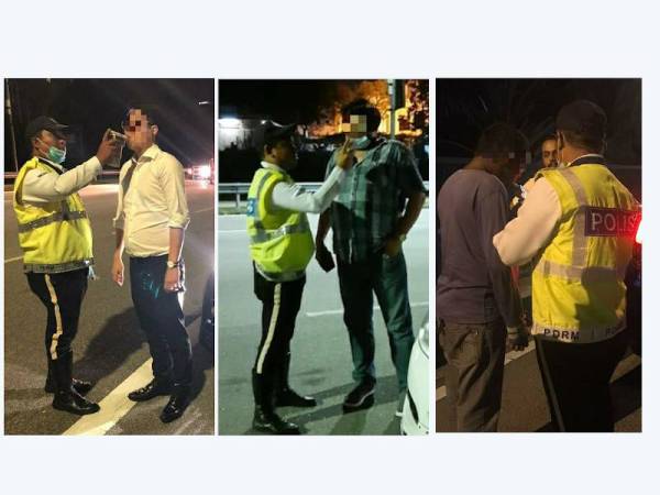 Anggota trafik sedang menjalankan ujian kandungan alkohol ke atas pemandu kenderaan.