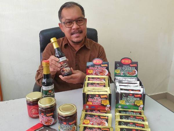 Mohd Zaki bangga dengan kejayaan produk Penang Best Classic White Coffee keluaran syarikatnya.