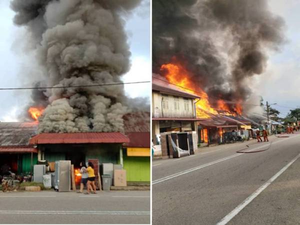 Bomba sedang memadam kebakaran yang melibatkan empat kedai di Pekan Air Mawang, Johol di sini pagi tadi. FOTO: Ihsan pembaca