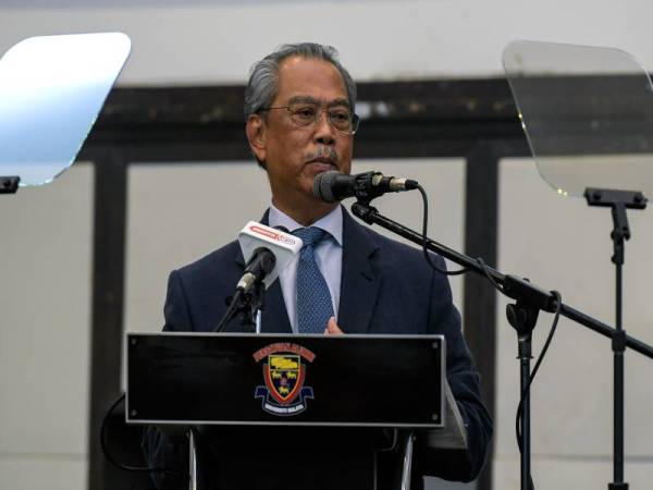 Muhyiddin Yassin berucap pada Konyensyen Setengah Tahun Pentadbiran Perikatan Nasional (PN) di Dewan Persatuan Alumni Universiti Malaya (PAUM), Kuala Lumpur hari ini. - Foto Bernama