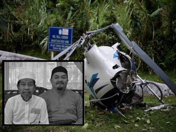 Nahas helikopter yang mengorbankan dua nyawa di Taman Melawati, Ampang, Kuala Lumpur semalam. Gambar kecil:
Allahyarham Mohd Irfan bersama bapanya.