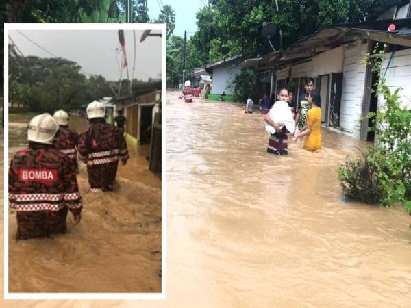 Anggota bomba dari BBP Tebrau meredah banjir kilat menyelamatkan mangsa-mangsa banjir di Jalan Permatang Utama, Kampung Kempas Baru, Johor Bahru hari ini.