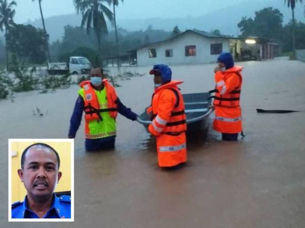 Pasukan APM membantu memindahkan mangsa yang terjejas banjir di Kuala Besut, Besut. - Foto APM (Gambar kecil: Che Adam)