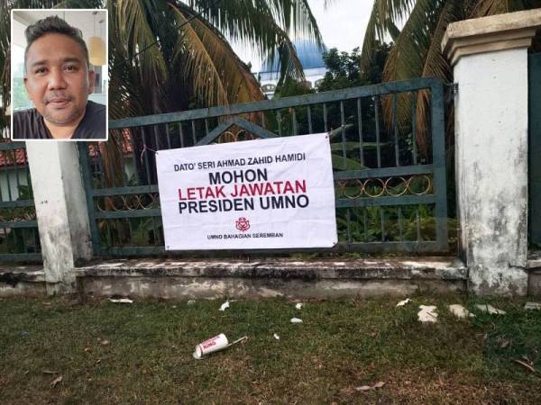 Kain rentang yang di pasang di pagar Masjid Sikamat pada Isnin. Gambar kecil: Zool Amali