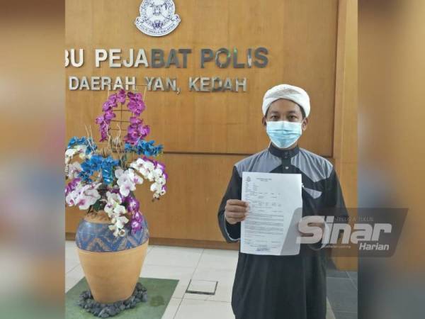 Noor Hakimi menunjukkan laporan polis yang dibuat di IPD Yan berhubung pendedahan Salahuddin.