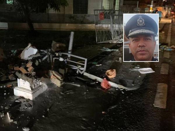 Pagar dua buah rumah yang dirempuh pemandu terbabit dalam kejadian di Jalan Bukit Senjuang, Melaka pada malam Selasa. Gambar kecil: Afzanizar Ahmad