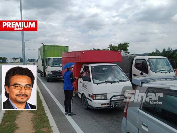 Antara aktiviti peniaga persimpangan lampu isyarat di Jalan Mokhtar Dahari, Puncak Alam. Gambar kecil: Shahrin Ahmad