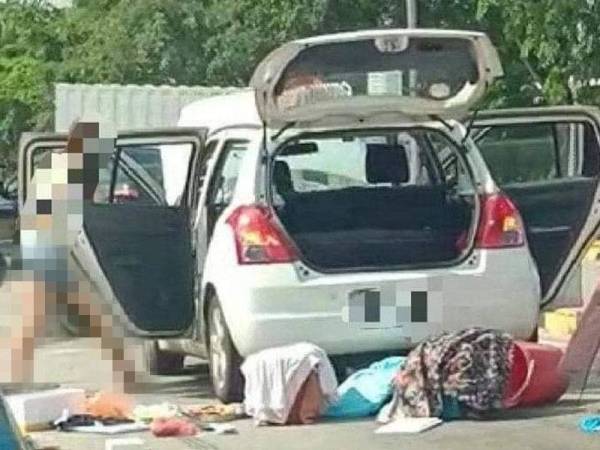 Tindakan wanita itu membuang sampah dirakam orang awam yang menyaksikan kejadian berkenaan. - Foto tular di Facebook