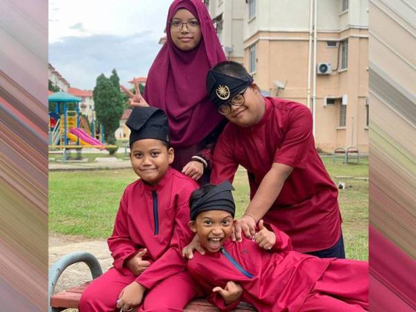 Muhamad Luqman Nazim (berdiri, belakang, kanan) bersama adik-beradiknya ketika bergambar pada lebaran baru-baru ini di Permatang Pauh, Pulau Pinang. - Foto Bernama