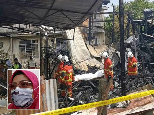 Anggota bomba membawa keluar mayat mangsa dari lokasi kebakaran di Kampung Losong Haji Su, di Kuala Terengganu. Gambar kecil: Zailah