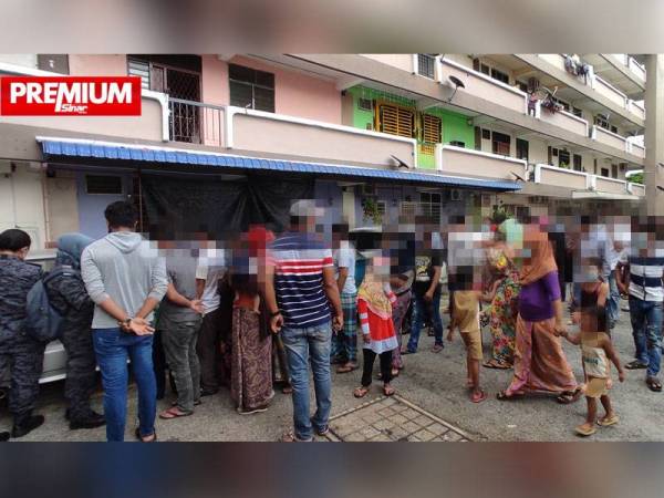 Sebahagian etnik Rohingya yang diperiksa Kementerian Dalam Negeri (KDN) di Pangsapuri Taman Sutera, Seberang Jaya, Pulau Pinang pada Selasa.