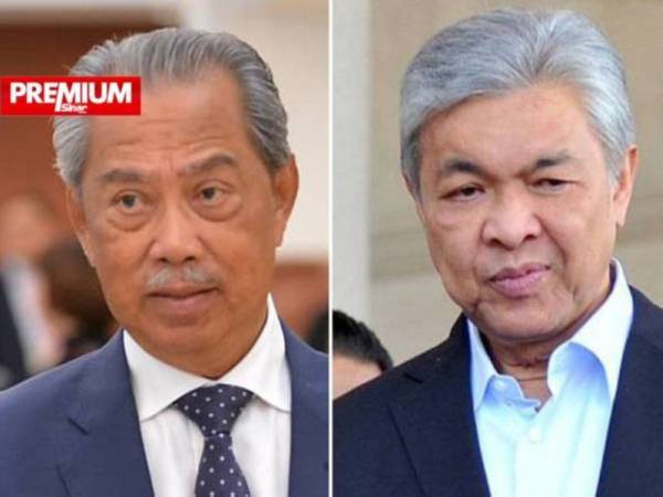 Antara kemungkinan berlaku sekiranya pimpinan Muhyiddin (kanan) enggan membuat keputusan dalam 14 hari ini adalah UMNO yang diketuai Ahmad Zahid menarik sokongan dalam kerajaan PN.